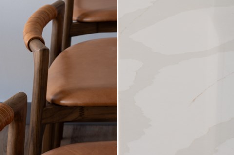 A wooden chair with a brown cushion.