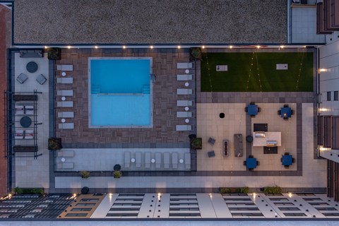 A modern building with a pool and a bar.