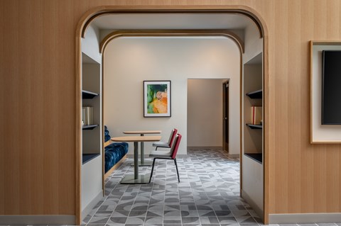 A room with a table and chairs in it.