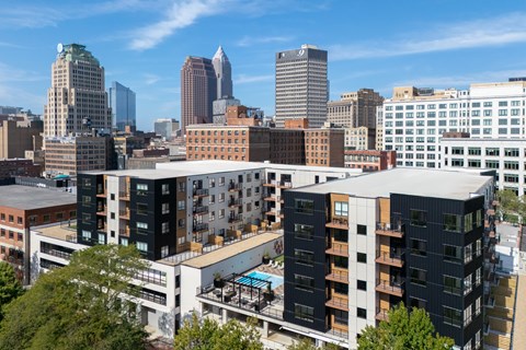 A cityscape with a mix of modern and older buildings.