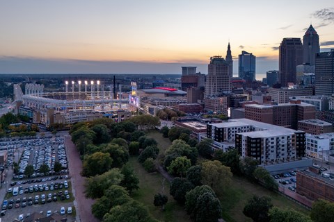 A cityscape with a large park area in the foreground.