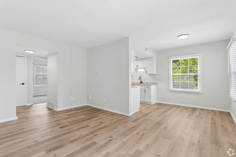 A room with wooden floors and white walls.