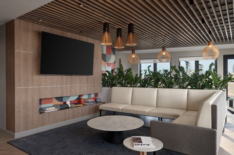 A modern living room with a large couch at The Park Apartments, Ohio, 44113