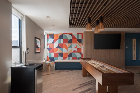 A room with a pool table and a bar at The Park Apartments, Cleveland 44113