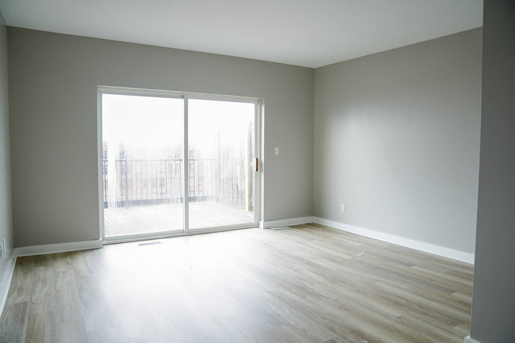 living room with sliding glass doors to a balcony