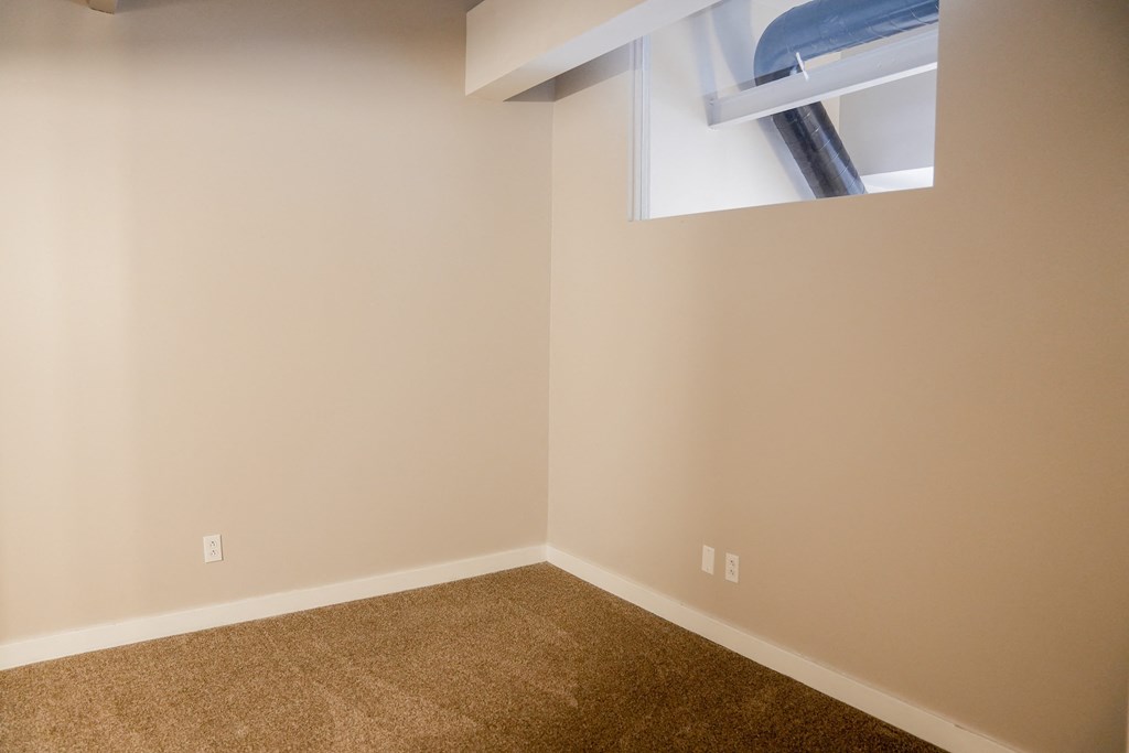 a bedroom with windows