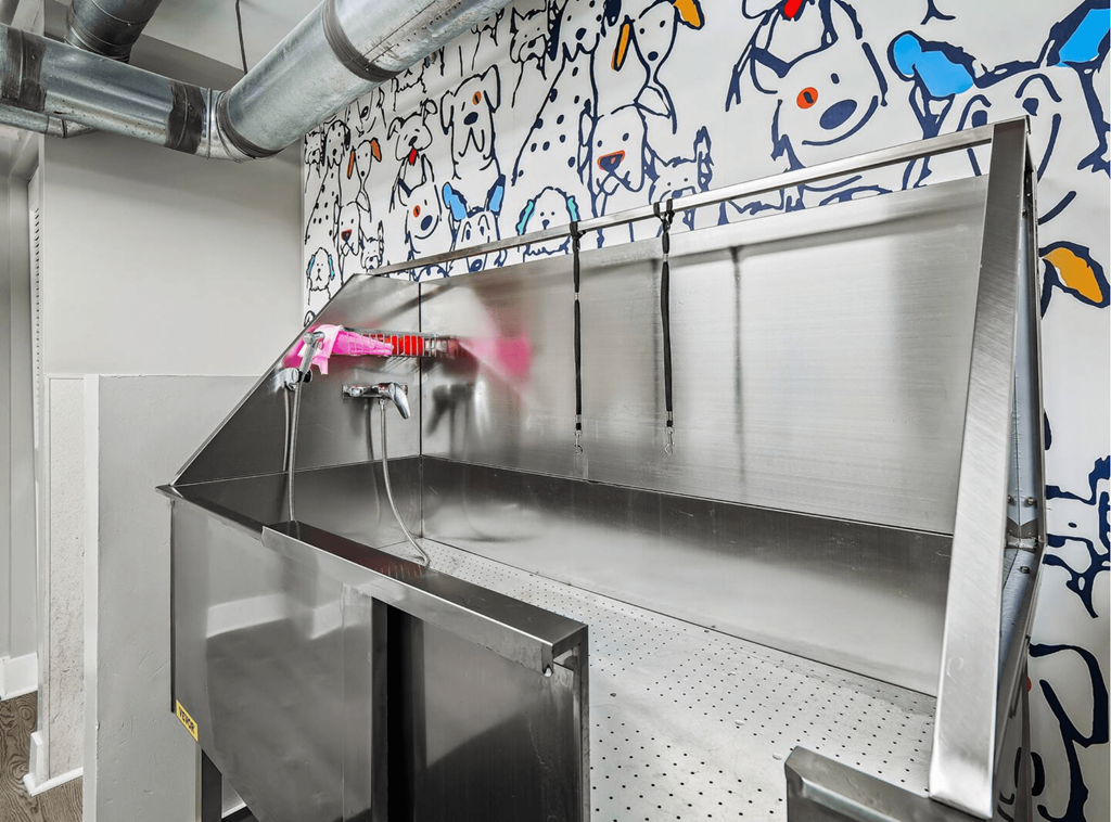 a kitchen with a stainless steel counter top and a sink