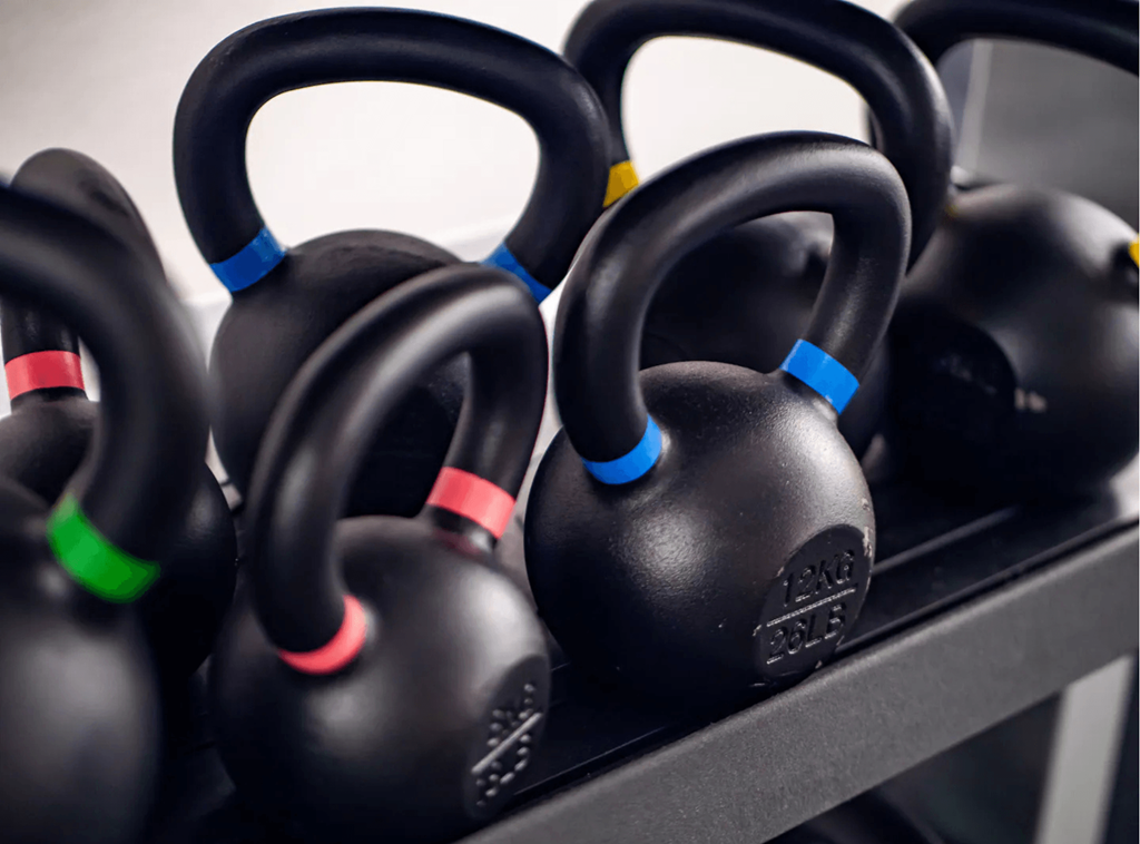 a row of dumbbells in a gym