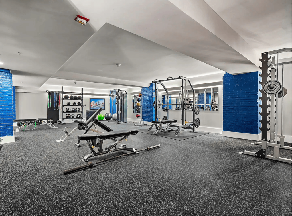 the gym at the condos is equipped with weights and other exercise equipment