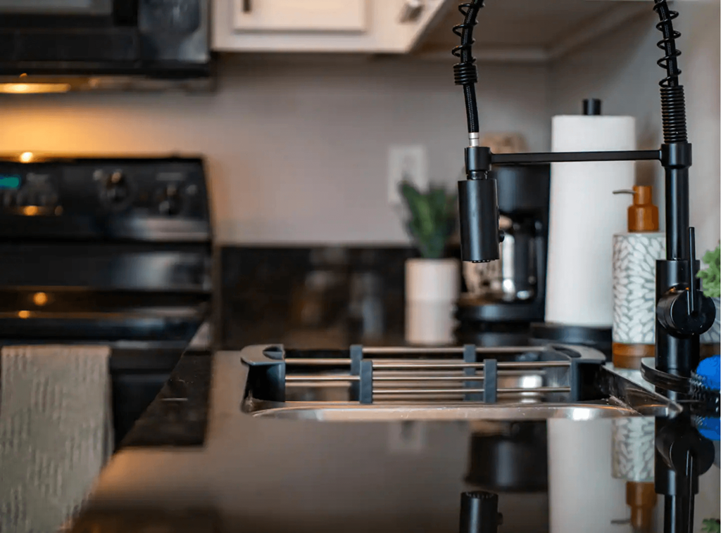 a kitchen with a sink and a stove