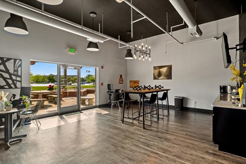 A modern kitchen with a dining table and chairs.