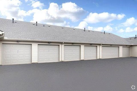 A row of white garage doors on a grey building.