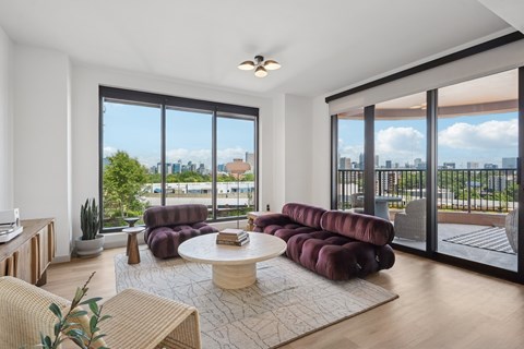 A living room with a view of the city.