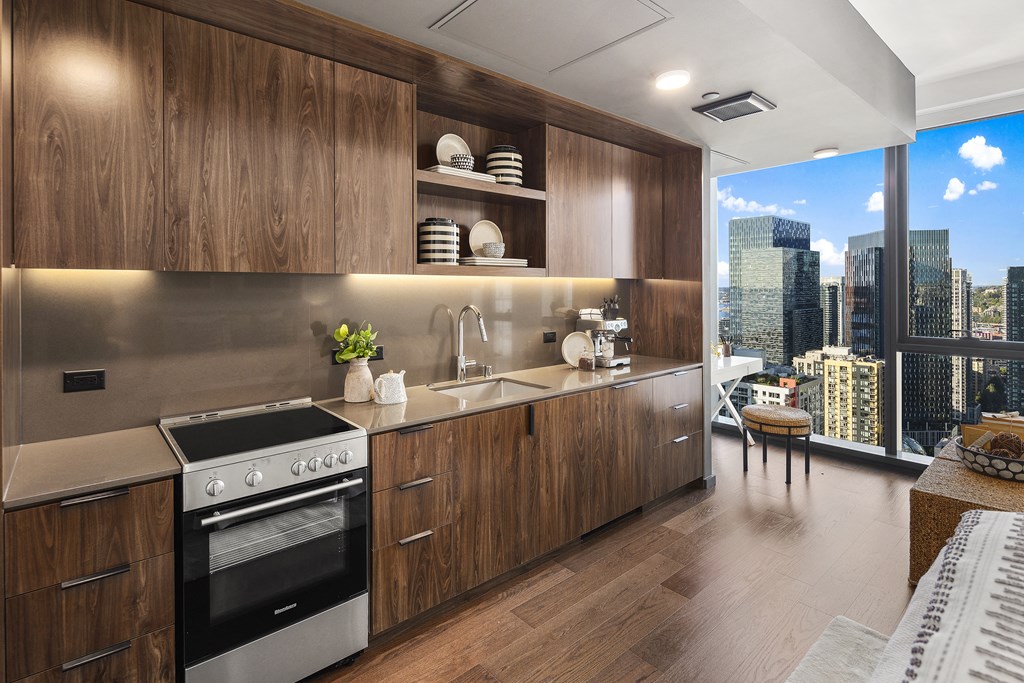 a kitchen with wooden cabinets and stainless steel appliances
