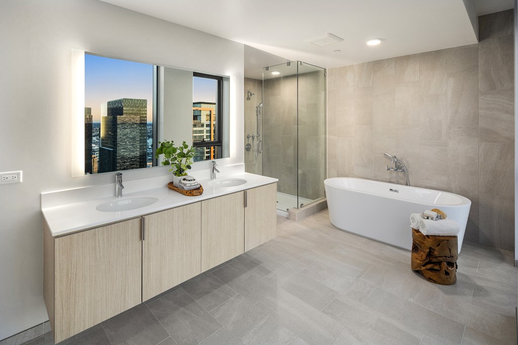 a bathroom with two sinks and a bathtub
