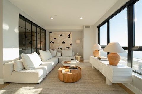 a living room with a white couch and a coffee table