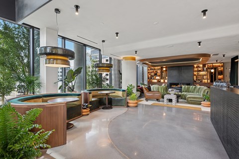 A modern living room with a fireplace and a large window.