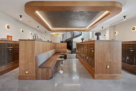 A modern interior with wooden furniture and a curved ceiling.