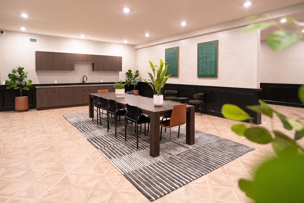 a dining room with a table and chairs