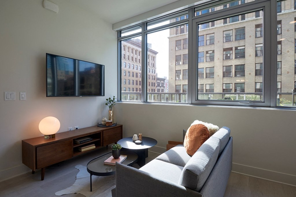 a living room with a couch and a large window