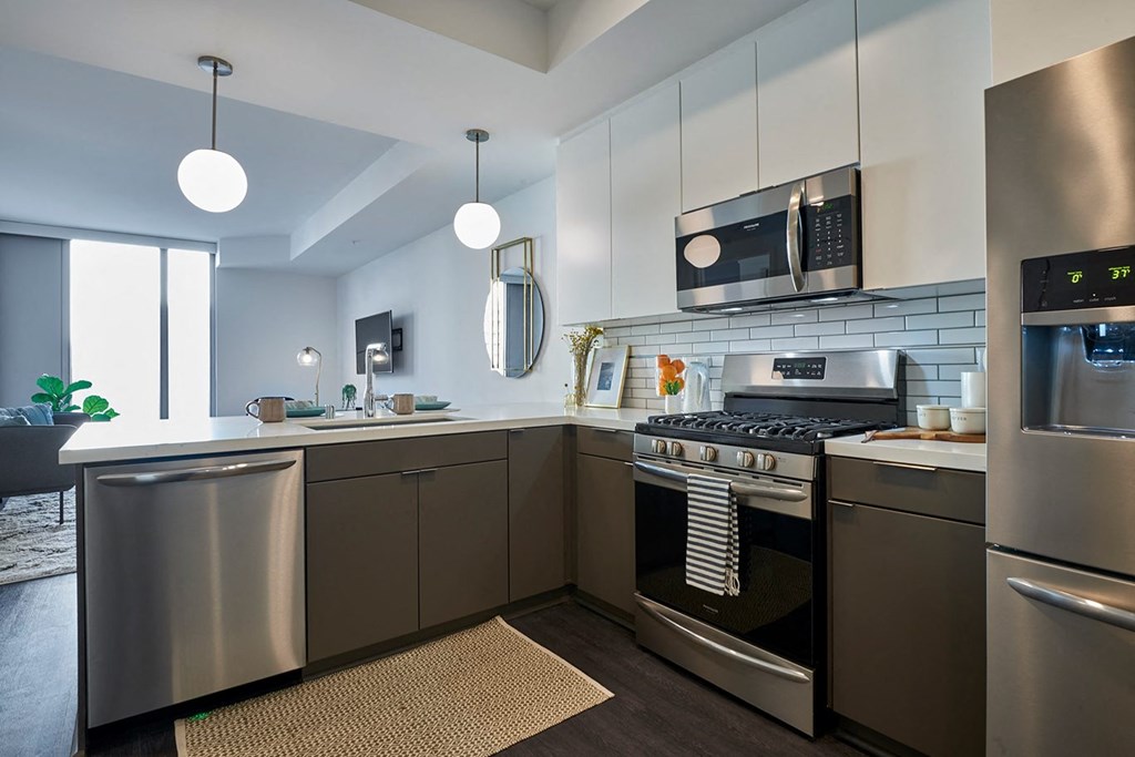 a kitchen with stainless steel appliances and stainless steel counters