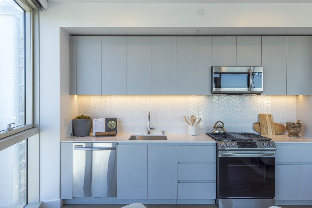 Kitchen with light finishes and stainless steel appliances