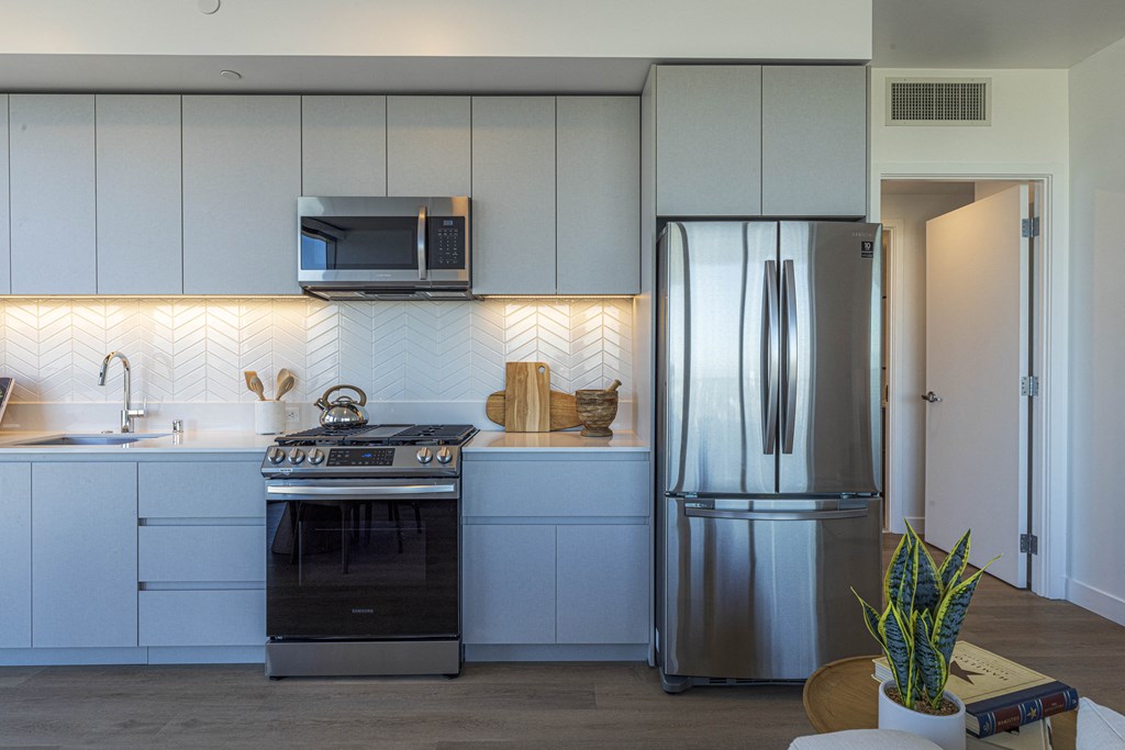 white kitchen with double door fridge