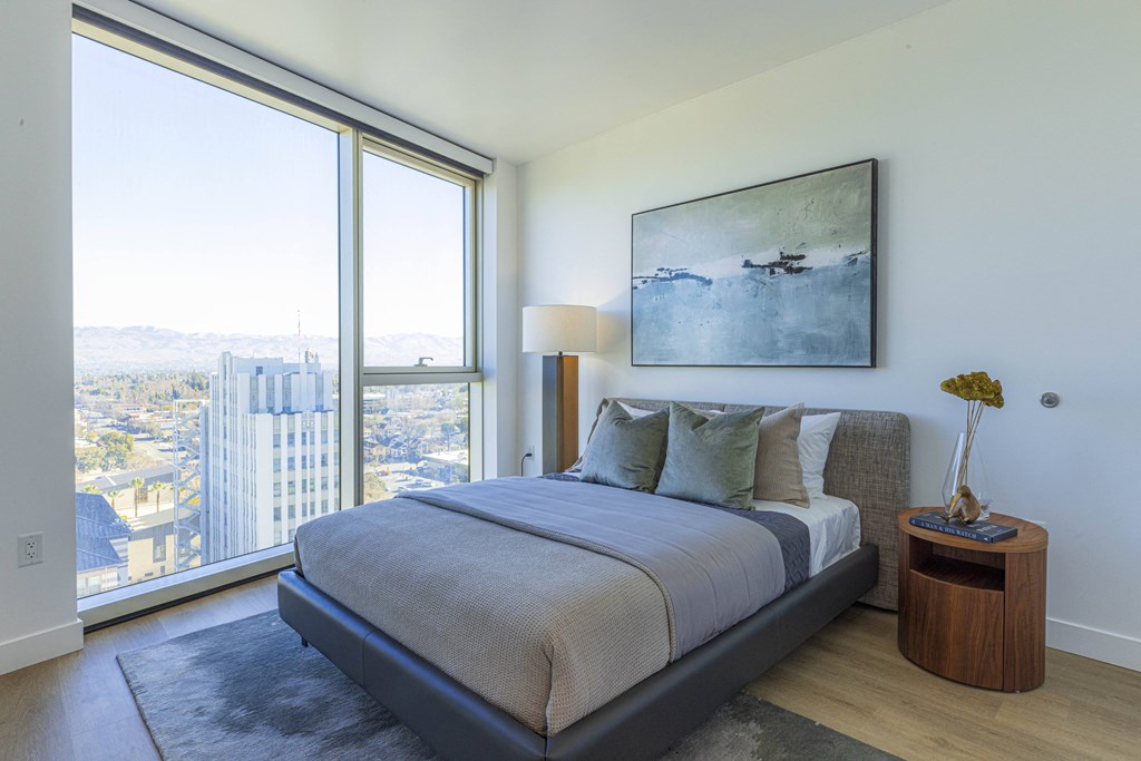 bedroom with floor to ceiling windows