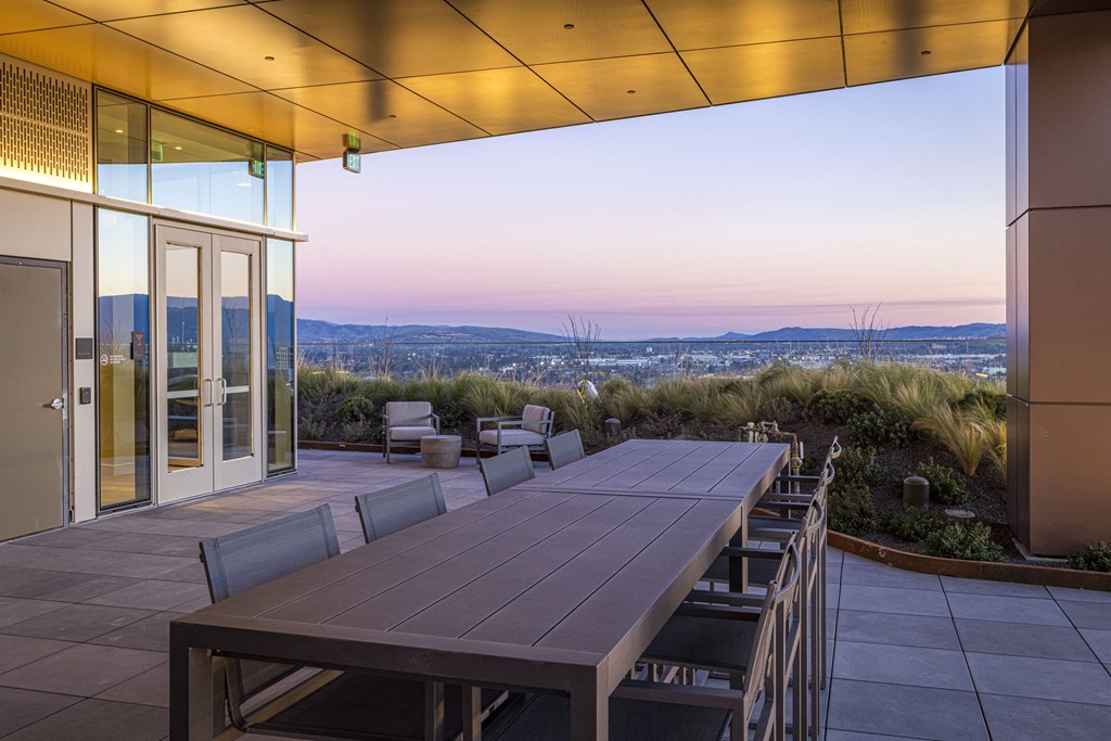 rooftop dining area with sunset views