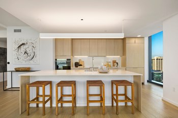 Kitchens feature natural quartz countertops, with full-stone backsplash