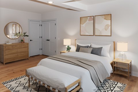 A bedroom with a large bed, a dresser, and a mirror.