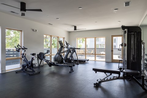 A spacious gym with a variety of exercise equipment.