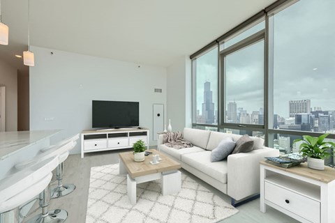 a living room with a white couch and a large window