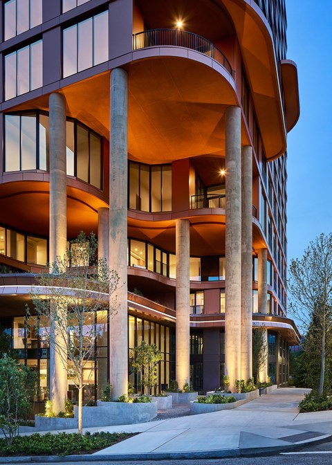 A modern building with a curved design and large windows at Stella at Star Metals in West Midtown, Atlanta.