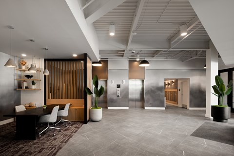 a large office space with a desk and chairs