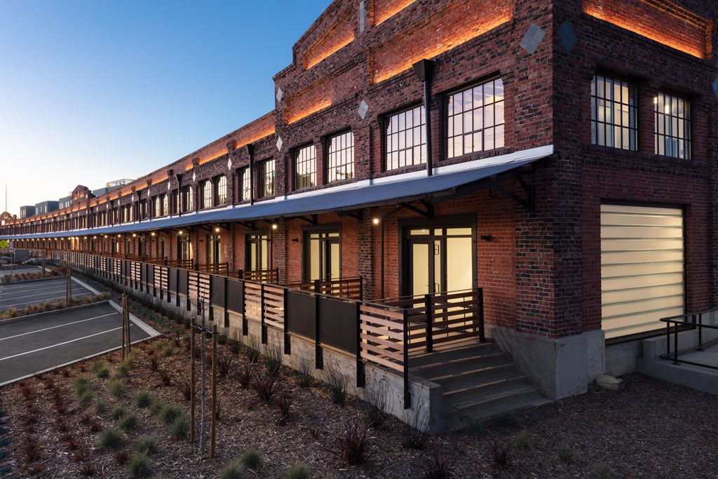 Twilight exterior of Star Harbor Apartments & Townhomes in Alameda, CA.