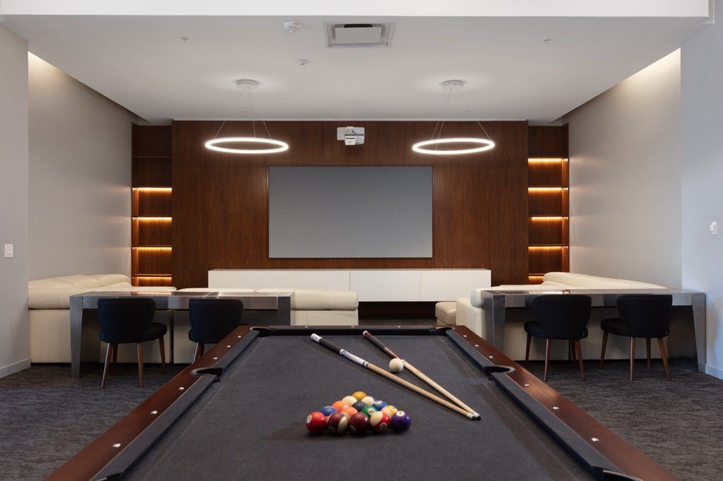 A pool table with a billiard set on it.