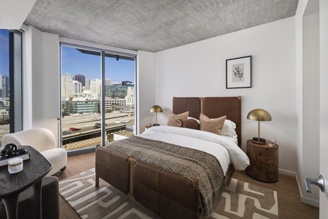 Quincy residential bedroom with floor to ceiling windows