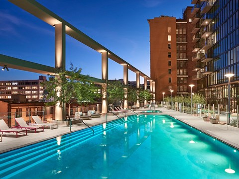 Rooftop pool and sundeck at dusk at Sentral DTLA.