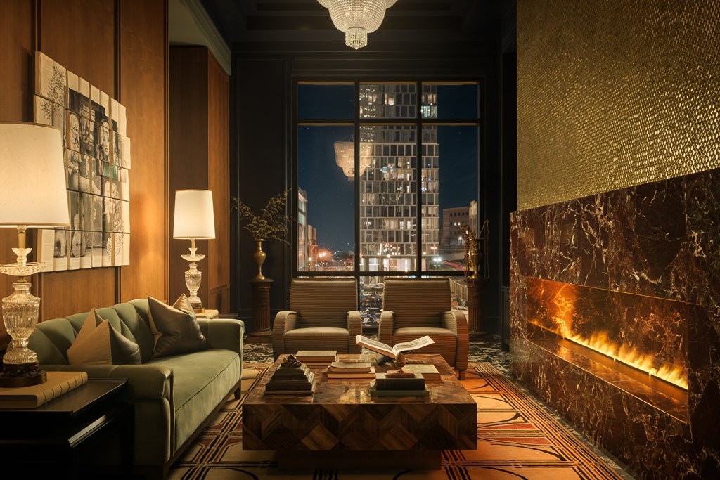 A living room with a green couch, a coffee table, and a fireplace.