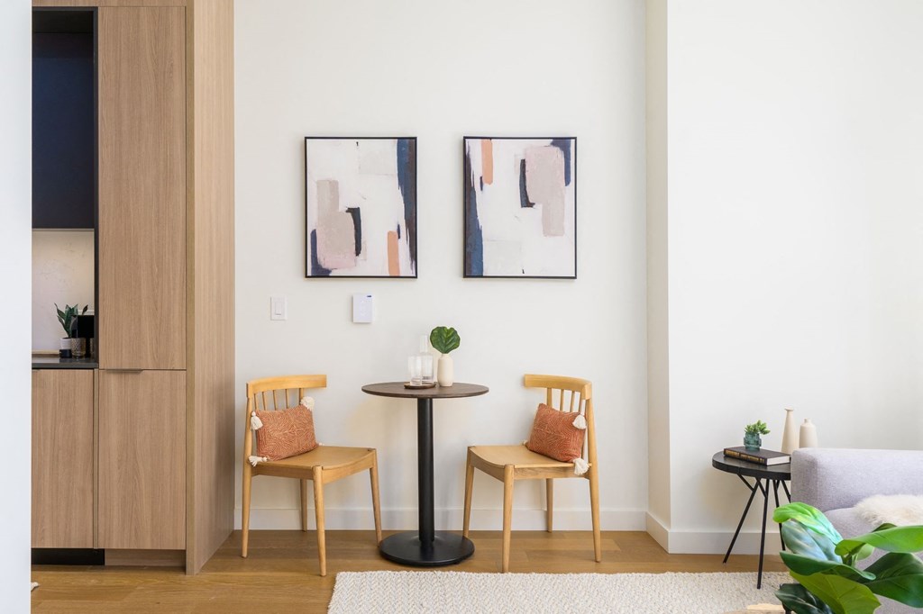 a small table with two chairs in a living room