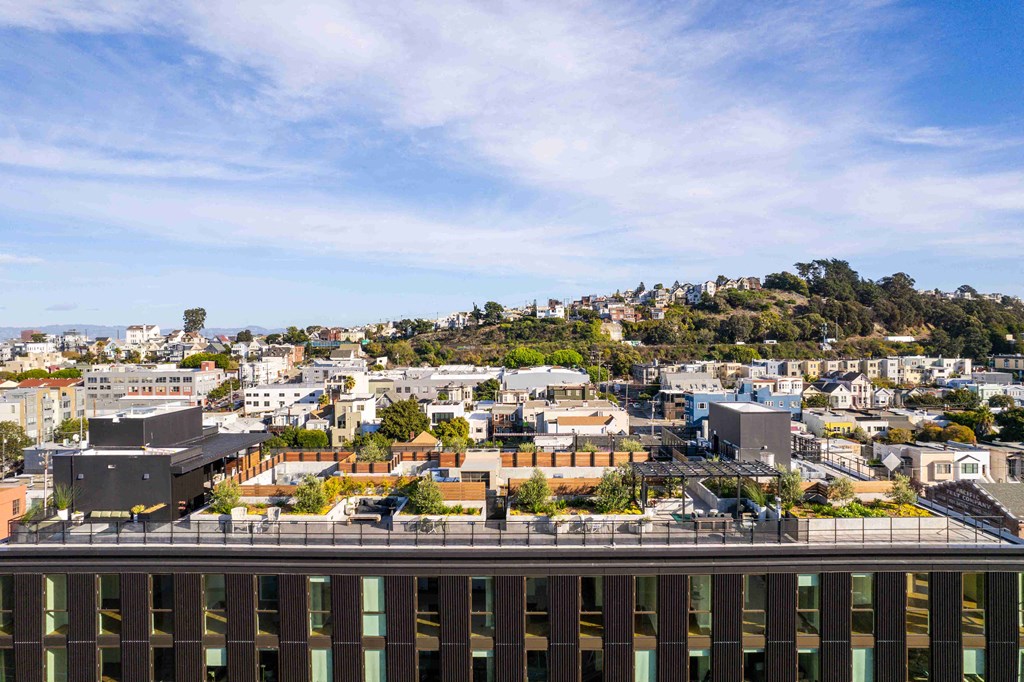the view of the city from the roof of a building