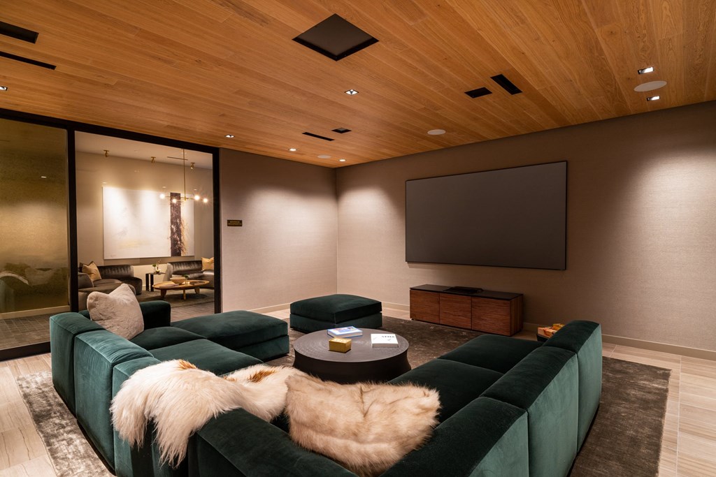 Private screening room with wood ceiling for enhanced acoustics