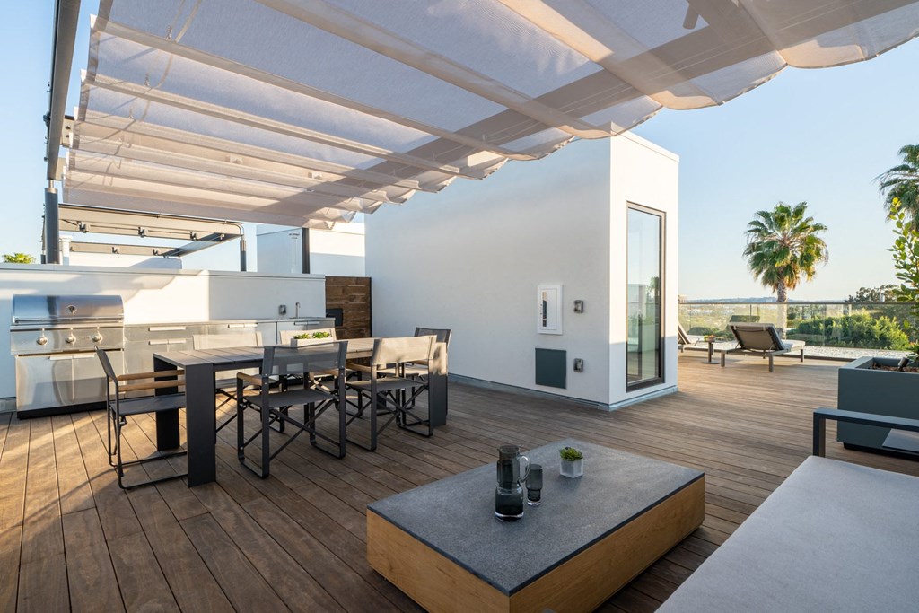 Select residences feature expansive rooftop terraces 
with shaded pergolas, integrated planters, wood decking, and an outdoor kitchen with sink and gas BBQ