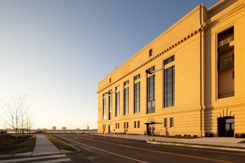a large yellow building on the side of a street