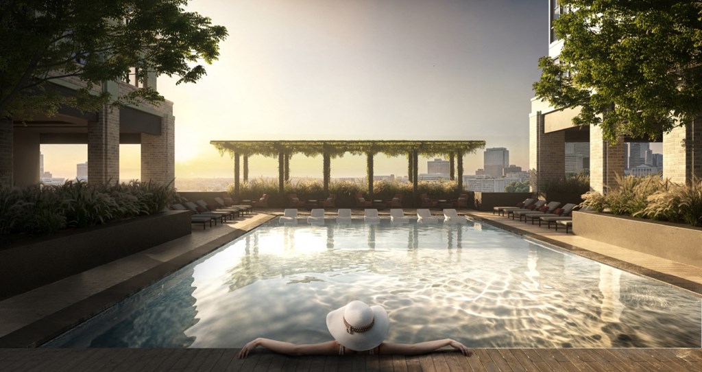 Resort-style pool and cabanas at The Everett Nashville Yards