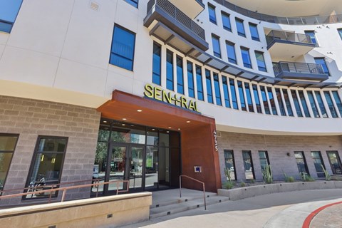 The image shows the front of a building with a Senatorial sign on it.