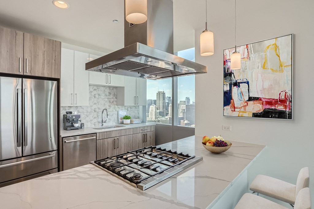 a kitchen with stainless steel appliances and a counter top