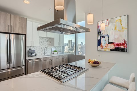 a kitchen with stainless steel appliances and a counter top