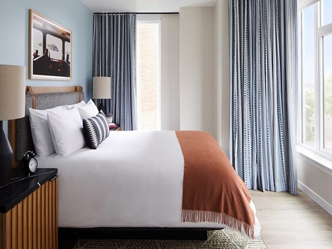 Designer-Furnished Apartment Suites with Comfy Beds and Luxury Linens Sentral First Hill Urban One-Bedroom Master Bedroom